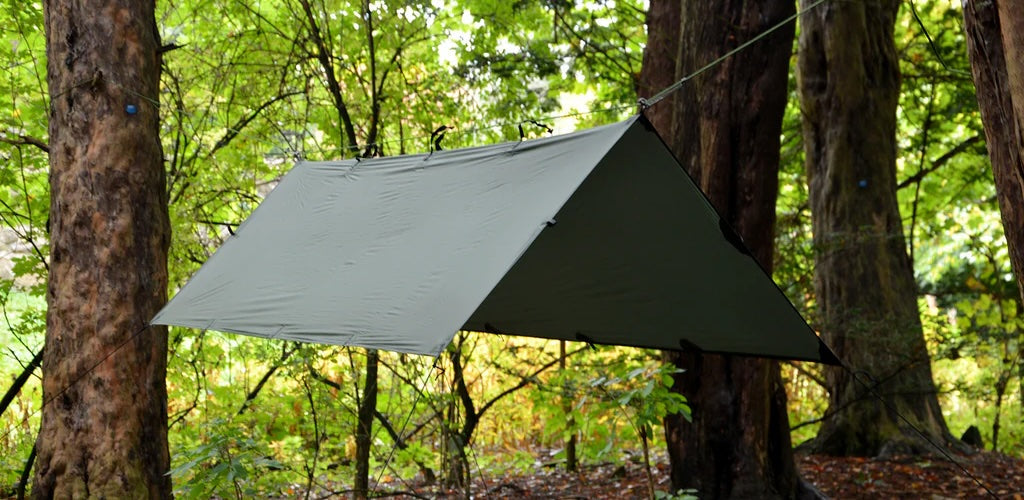 Setting up a tarp for camping, Forest School or shade